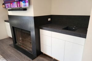 Black Leathered Granite Wet Bar and Fireplace Surround