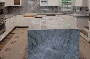 White Borealis Quartzite Kitchen with Full Backsplash and Waterfall Panel